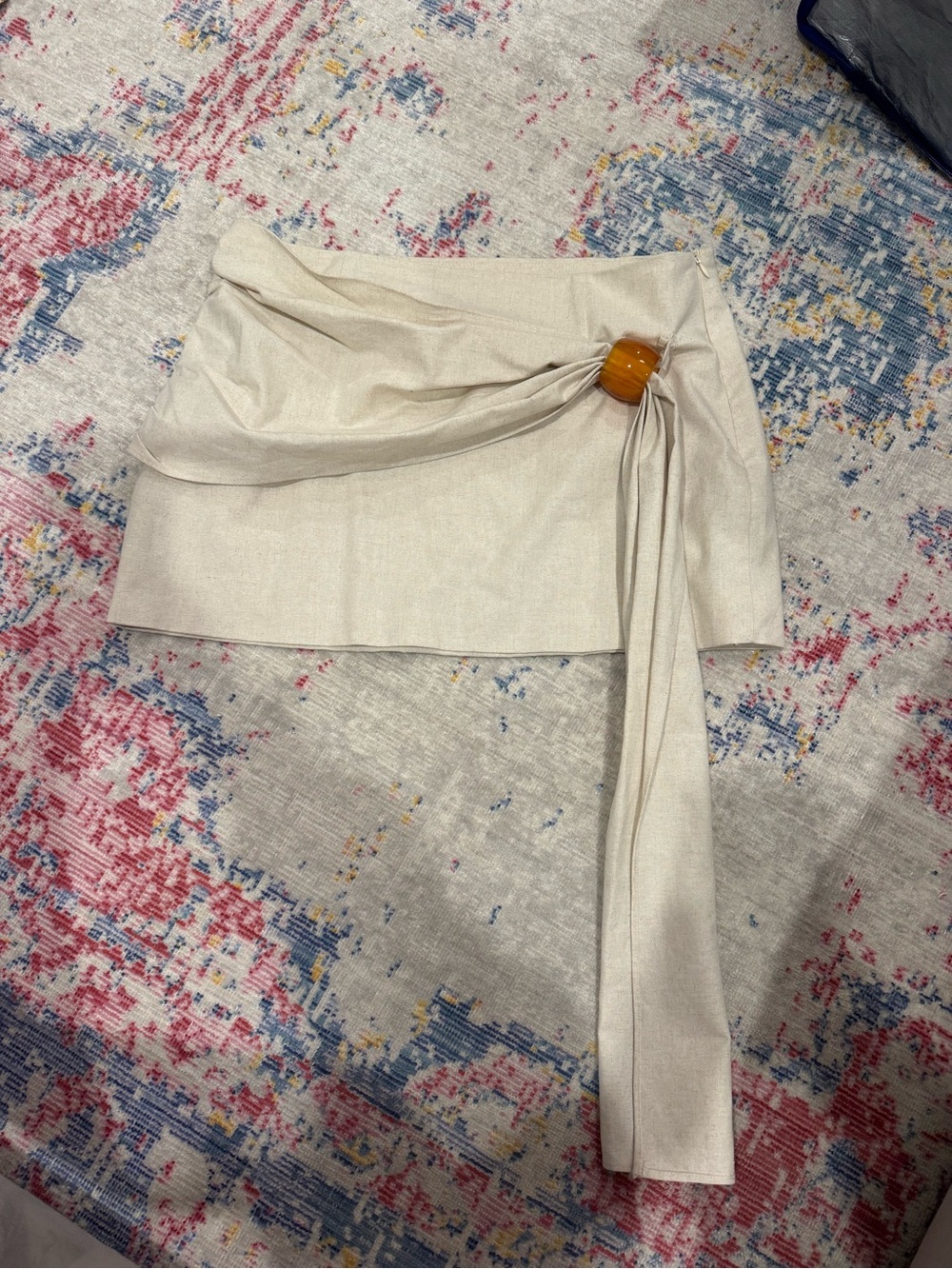 Draped Beige Mini Skirt with Amber Buckle Accent
